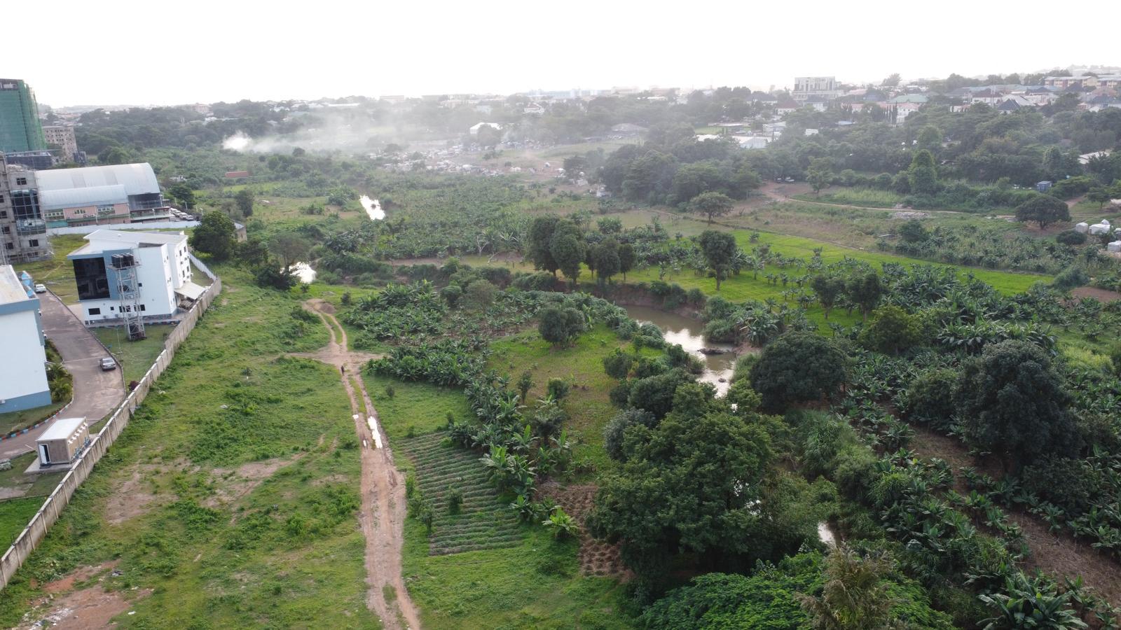 Land beside a road near a bridge